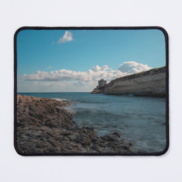 Item preview, Seaside Rocky Coastline With Historic Tower on Cliff Under Blue Sky and Clouds designed and sold by Nmallia.