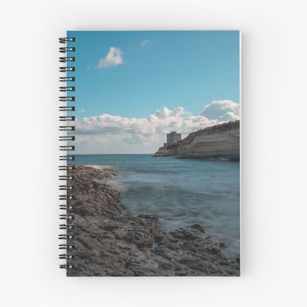 Item preview, Seaside Rocky Coastline With Historic Tower on Cliff Under Blue Sky and Clouds designed and sold by Nmallia.