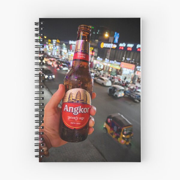 Item preview, Holding an Angkor beer bottle in Phnom Penh, Cambodia during a busy evening scene. designed and sold by Kevin Miller Photography.