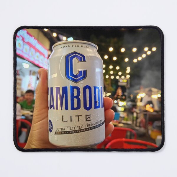 Item preview, Holding an Angkor beer bottle in Phnom Penh, Cambodia during a busy evening scene. designed and sold by Kevin Miller Photography.