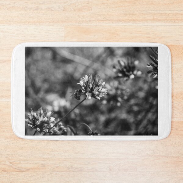 Item preview, Monochrome Close-Up of Bee Pollinating Clover Flower in Wild Meadow With Soft Bokeh designed and sold by Nmallia.