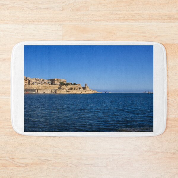 Item preview, Sunny Coastal City Harbor With Historic Fortifications Over Deep Blue Sea And Clear Sky designed and sold by Nmallia.