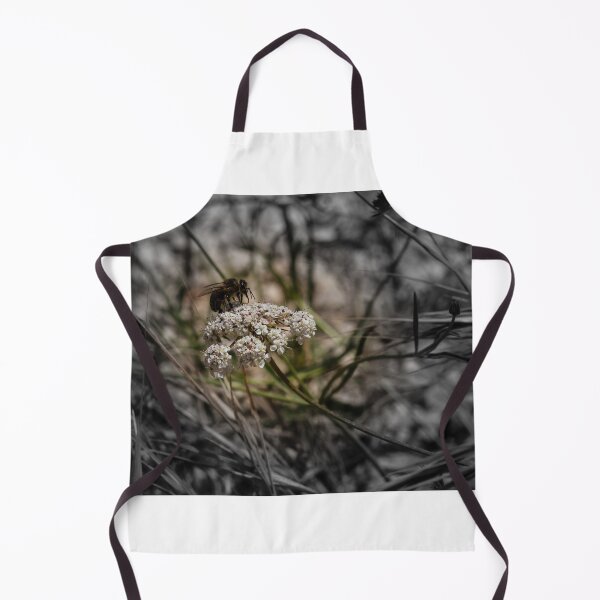 Item preview, Honey Bee Pollinating White Wildflower Among Grasses With Selective Color Shallow Depth Of Field designed and sold by Nmallia.