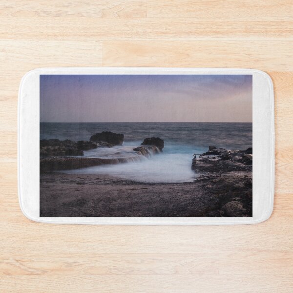 Item preview, Long Exposure Seascape At Rocky Coast With Misty Waves And Pastel Twilight Sky Over Ocean designed and sold by Nmallia.