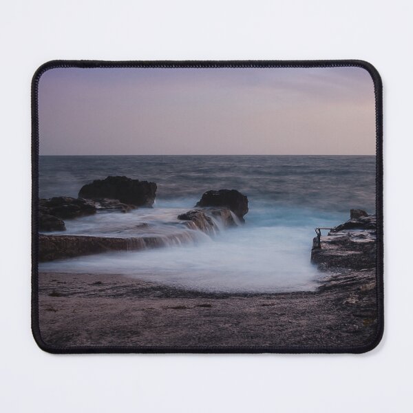 Item preview, Long Exposure Seascape At Rocky Coast With Misty Waves And Pastel Twilight Sky Over Ocean designed and sold by Nmallia.