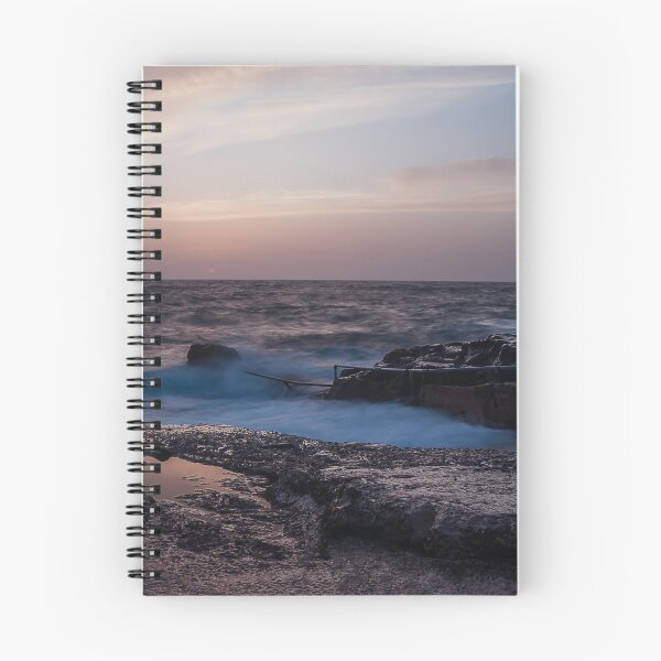 Item preview, Long Exposure Seascape At Rocky Coast With Misty Waves And Pastel Twilight Sky Over Ocean designed and sold by Nmallia.