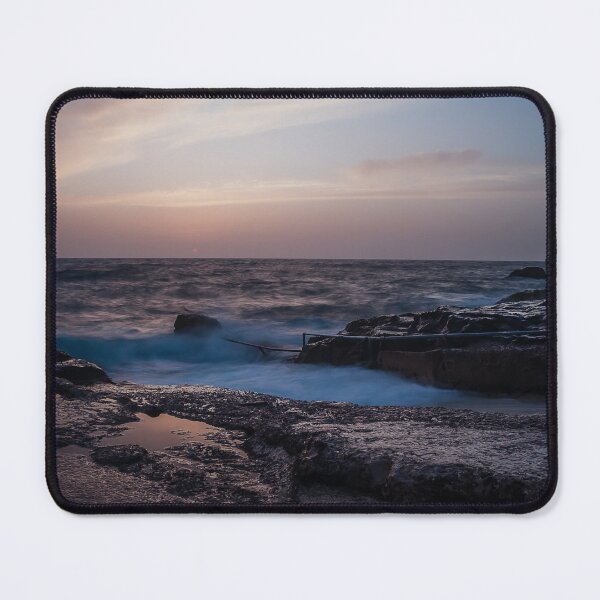 Item preview, Long Exposure Seascape At Rocky Coast With Misty Waves And Pastel Twilight Sky Over Ocean designed and sold by Nmallia.