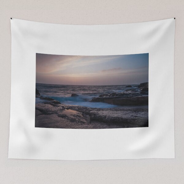 Item preview, Long Exposure Seascape At Rocky Coast With Misty Waves And Pastel Twilight Sky Over Ocean designed and sold by Nmallia.