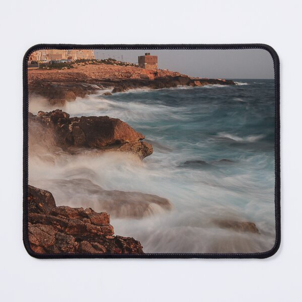 Item preview, Rocky Coastline With Waves Crashing Against Cliffs Near A Seaside Village At Dusk designed and sold by Nmallia.