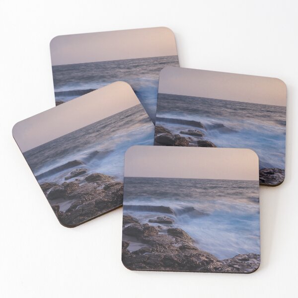 Item preview, Rocky Coastline With Waves Crashing Against Cliffs Near A Seaside Village At Dusk designed and sold by Nmallia.