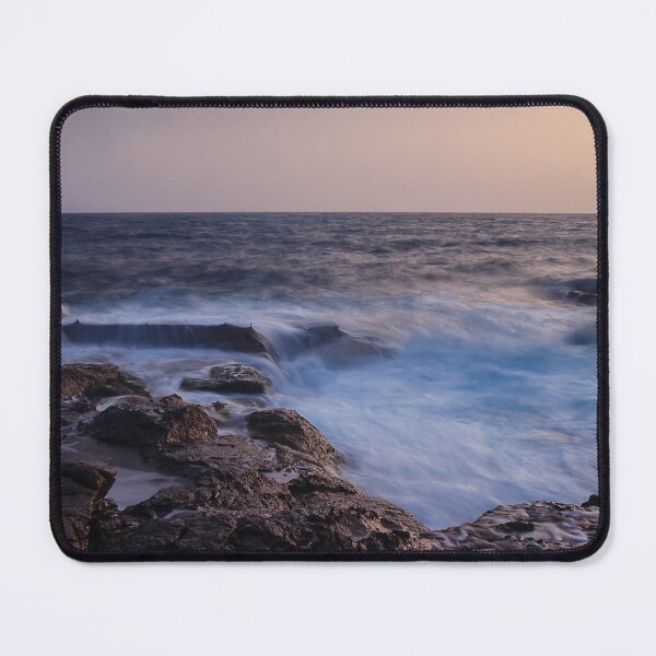 Item preview, Rocky Coastline With Waves Crashing Against Cliffs Near A Seaside Village At Dusk designed and sold by Nmallia.