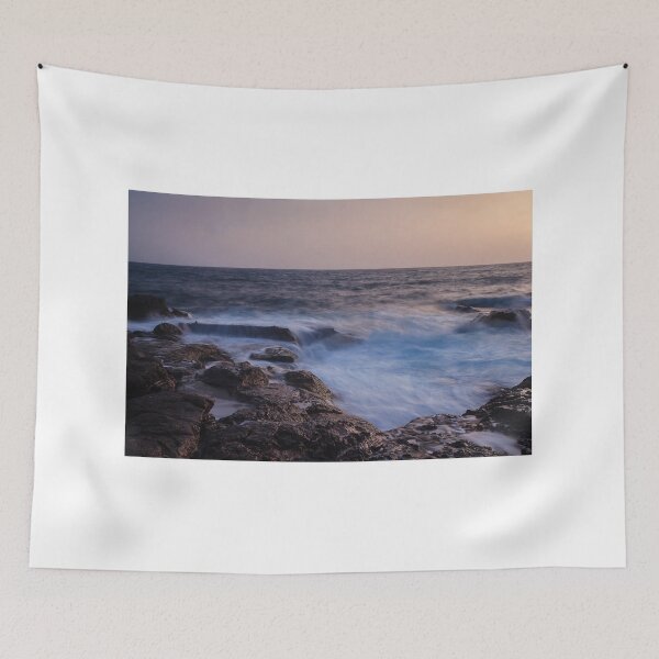 Item preview, Rocky Coastline With Waves Crashing Against Cliffs Near A Seaside Village At Dusk designed and sold by Nmallia.