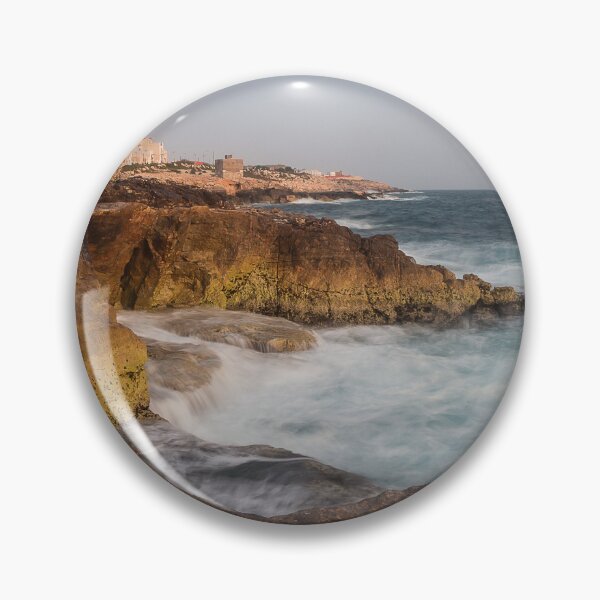 Item preview, Rocky Coastline With Waves Crashing Against Cliffs Near A Seaside Village At Dusk designed and sold by Nmallia.