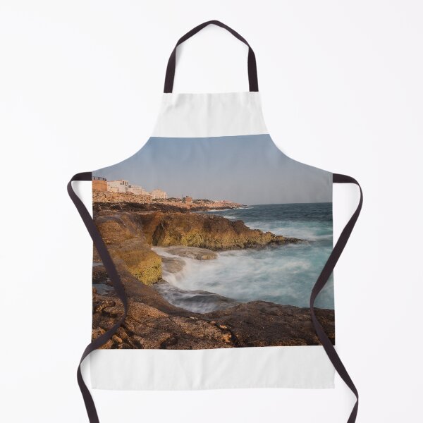 Item preview, Rocky Coastline With Waves Crashing Against Cliffs Near A Seaside Village At Dusk designed and sold by Nmallia.
