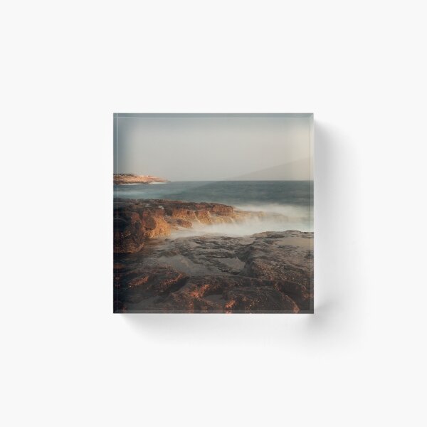 Item preview, Rocky Coastline With Waves Crashing Against Cliffs Near A Seaside Village At Dusk designed and sold by Nmallia.