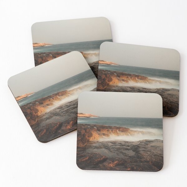 Item preview, Rocky Coastline With Waves Crashing Against Cliffs Near A Seaside Village At Dusk designed and sold by Nmallia.