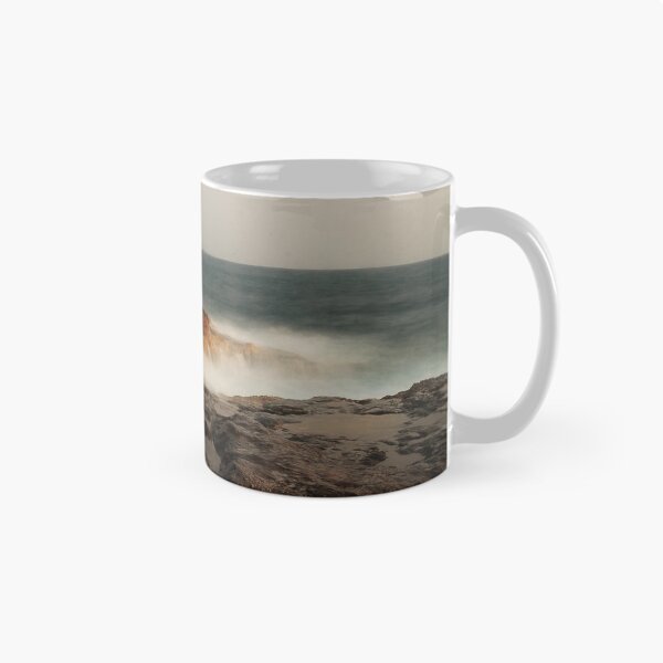 Item preview, Rocky Coastline With Waves Crashing Against Cliffs Near A Seaside Village At Dusk designed and sold by Nmallia.