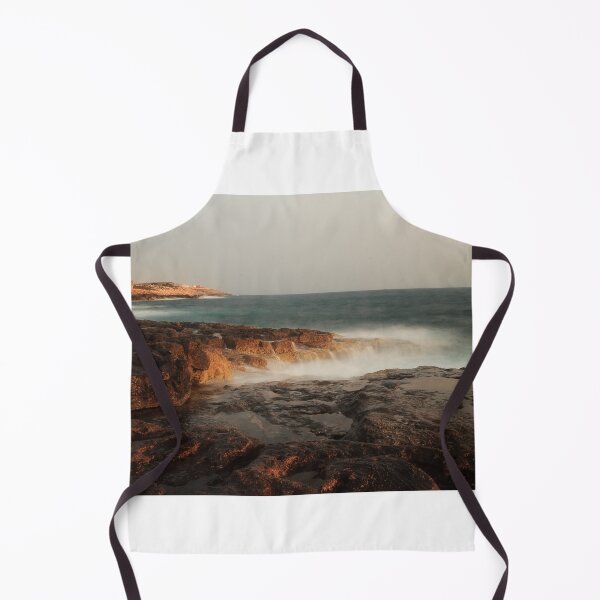 Item preview, Rocky Coastline With Waves Crashing Against Cliffs Near A Seaside Village At Dusk designed and sold by Nmallia.