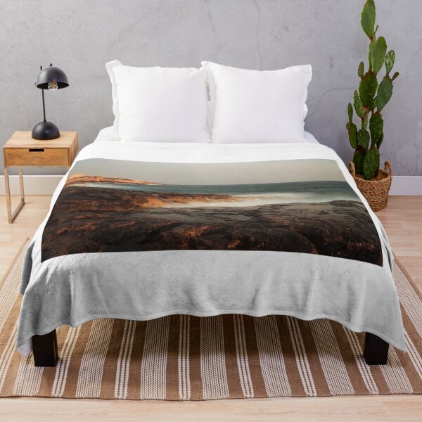 Item preview, Rocky Coastline With Waves Crashing Against Cliffs Near A Seaside Village At Dusk designed and sold by Nmallia.