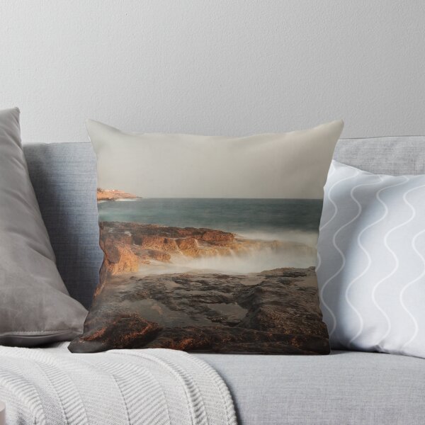 Item preview, Rocky Coastline With Waves Crashing Against Cliffs Near A Seaside Village At Dusk designed and sold by Nmallia.