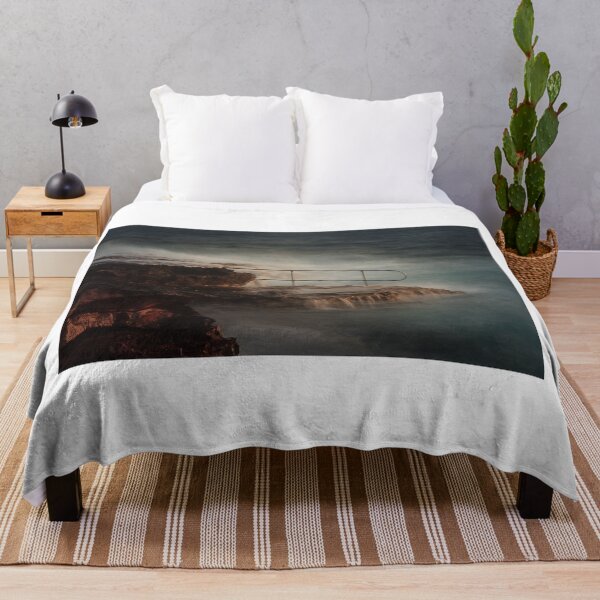 Item preview, Rocky Coastline With Waves Crashing Against Cliffs Near A Seaside Village At Dusk designed and sold by Nmallia.