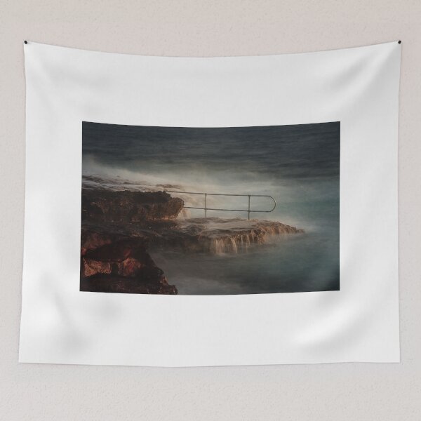 Item preview, Rocky Coastline With Waves Crashing Against Cliffs Near A Seaside Village At Dusk designed and sold by Nmallia.