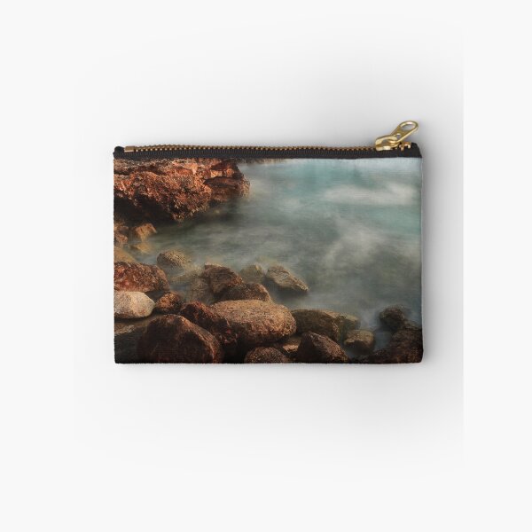 Item preview, Rocky Coastline With Waves Crashing Against Cliffs Near A Seaside Village At Dusk designed and sold by Nmallia.