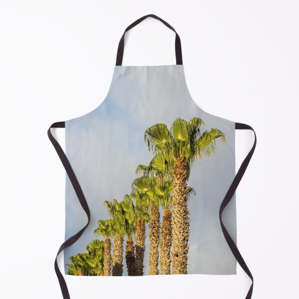 Item preview, Row of Sunlit Palm Trees Against Blue Sky With Soft Clouds in Tropical Landscape designed and sold by Nmallia.