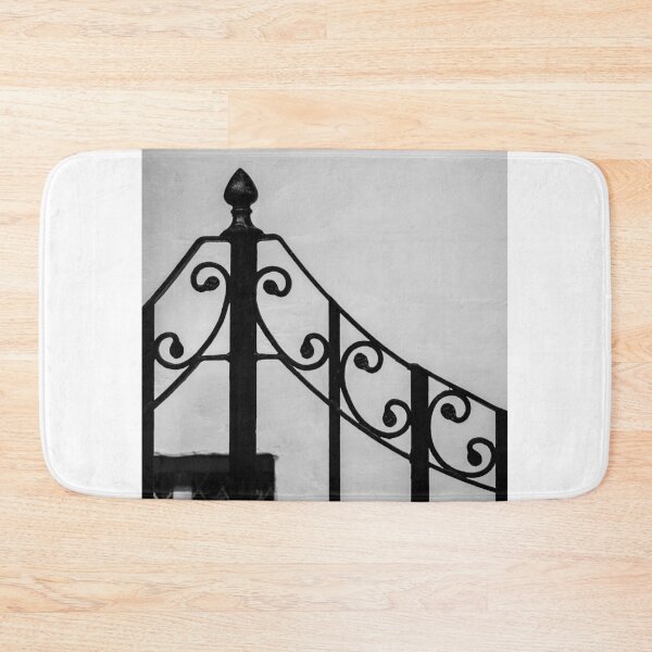 Item preview, Black Wrought-Iron Gate With Scrollwork Against White Plastered Wall Minimal Architectural Detail designed and sold by Nmallia.