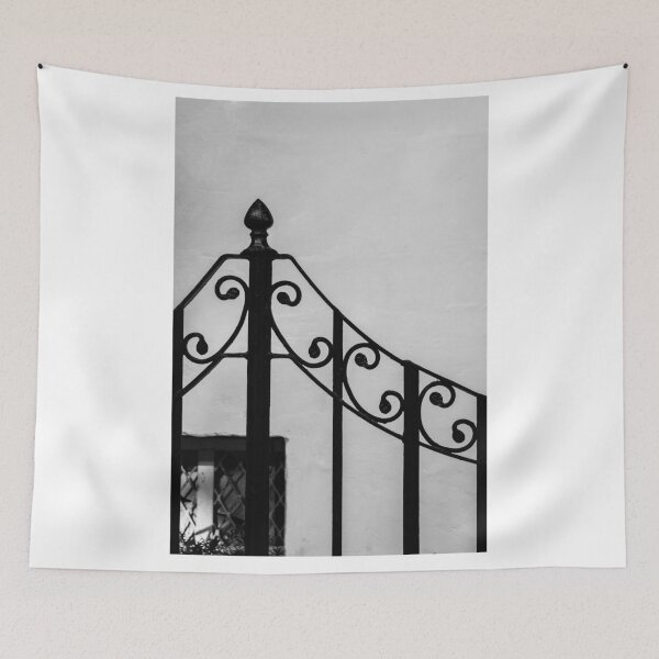 Item preview, Black Wrought-Iron Gate With Scrollwork Against White Plastered Wall Minimal Architectural Detail designed and sold by Nmallia.