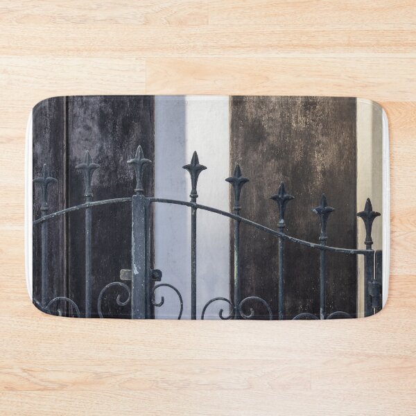 Item preview, Vintage Iron Gate With Ornate Fleur-De-Lis Finials in Front of Weathered Wooden Doors designed and sold by Nmallia.