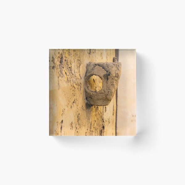 Item preview, Weathered Stone Wall With Circular Hole Detail On Ancient Yellow Plastered Architectural Facade designed and sold by Nmallia.