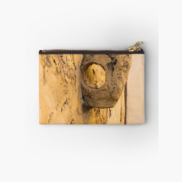 Item preview, Weathered Stone Wall With Circular Hole Detail On Ancient Yellow Plastered Architectural Facade designed and sold by Nmallia.