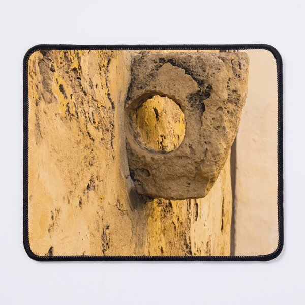 Item preview, Weathered Stone Wall With Circular Hole Detail On Ancient Yellow Plastered Architectural Facade designed and sold by Nmallia.