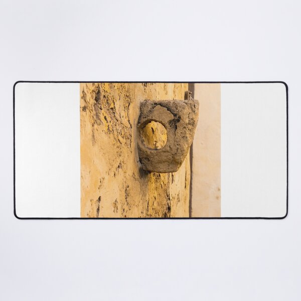Item preview, Weathered Stone Wall With Circular Hole Detail On Ancient Yellow Plastered Architectural Facade designed and sold by Nmallia.