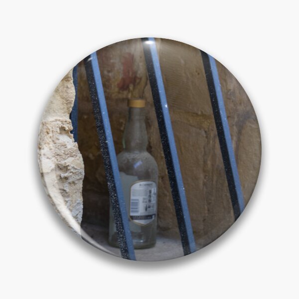 Item preview, Abandoned Glass Bottle Behind Iron Bars In Stone Window Alcove In Urban Nook designed and sold by Nmallia.