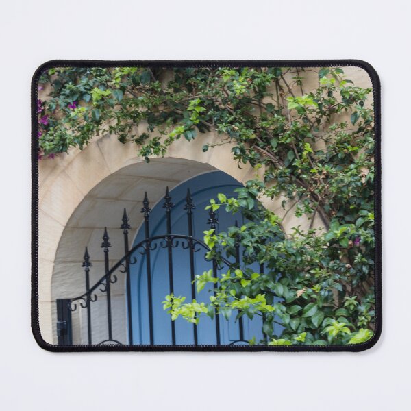 Item preview, Blue Arched Door With Wrought Iron Gate and Climbing Bougainvillea on Stone Wall designed and sold by Nmallia.