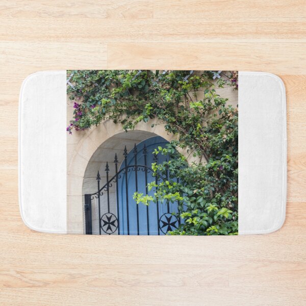 Item preview, Blue Arched Door With Wrought Iron Gate and Climbing Bougainvillea on Stone Wall designed and sold by Nmallia.
