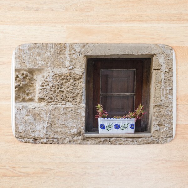 Item preview, Sunlit Stone Building Wooden Window With Colorful Flower Boxes On Mediterranean Facade designed and sold by Nmallia.