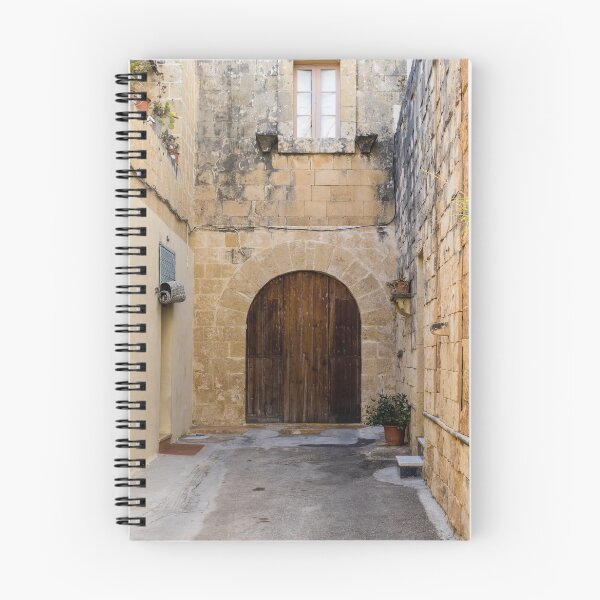 Item preview, Sunlit Stone Archway With Large Wooden Door In Narrow Mediterranean Alleyway designed and sold by Nmallia.