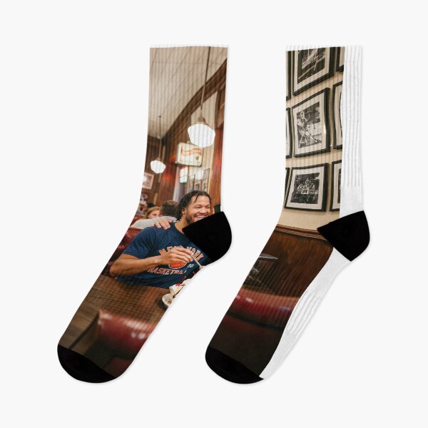 Item preview, Jalen Brunson NY Knicks Sharing Ice Cream With Knick Fan designed and sold by Home Decor Art.