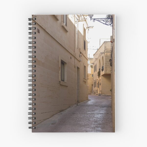 Item preview, Quiet Narrow Stone Alleyway Between Historic Buildings With Wall Lanterns And Mediterranean Character designed and sold by Nmallia.