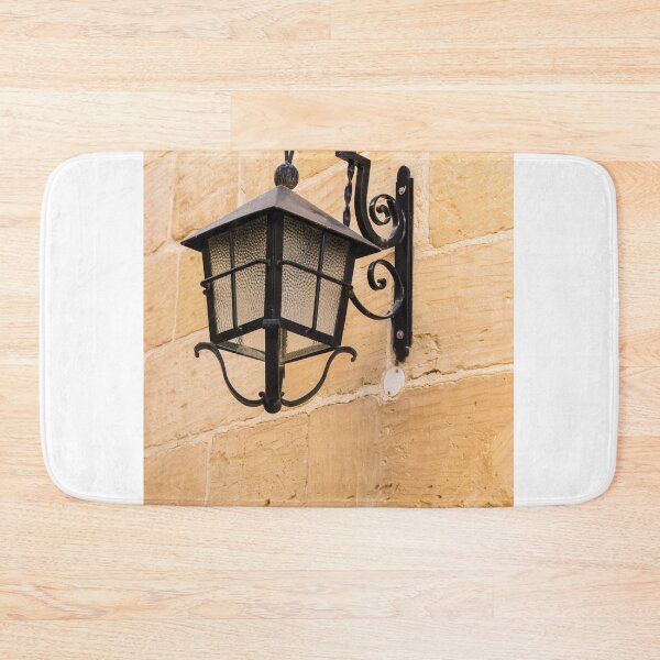 Item preview, Vintage Black Iron Lantern Wall Lamp Mounted On Sandstone Wall Outside Historic Building designed and sold by Nmallia.