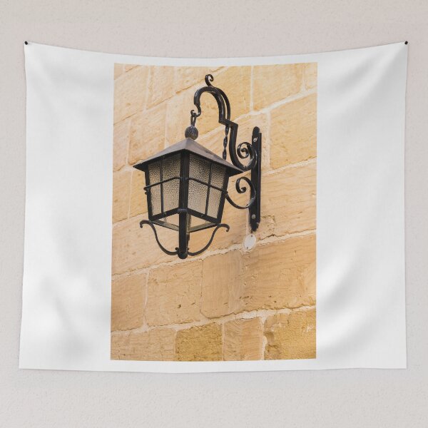 Item preview, Vintage Black Iron Lantern Wall Lamp Mounted On Sandstone Wall Outside Historic Building designed and sold by Nmallia.