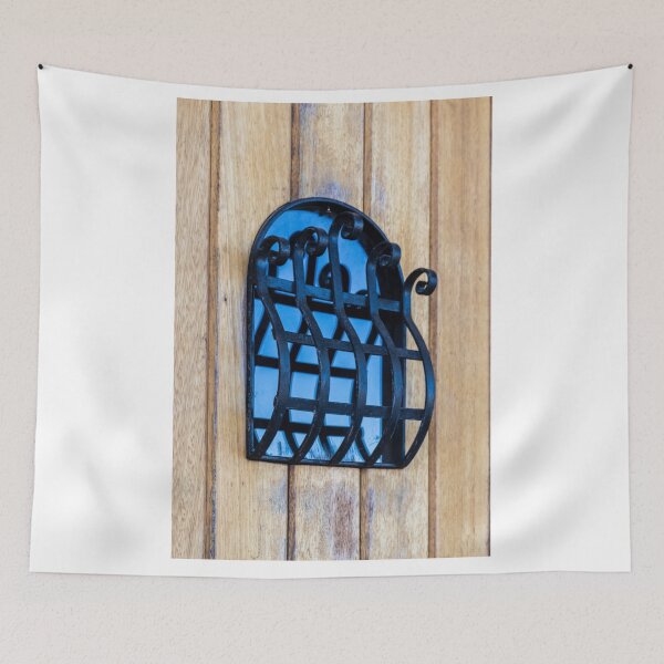 Item preview, Decorative Wrought Iron Window Grille on Wooden Door With Blue Glass Reflection designed and sold by Nmallia.