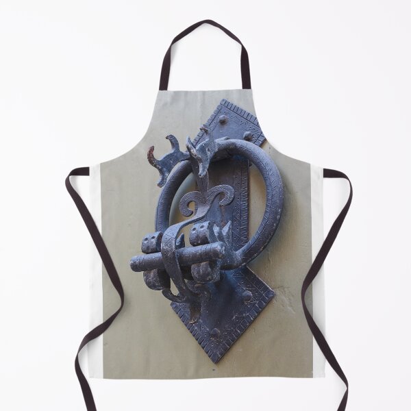 Item preview, Antique Iron Door Knocker Close-Up On Weathered Wooden Door With Decorative Hardware designed and sold by Nmallia.
