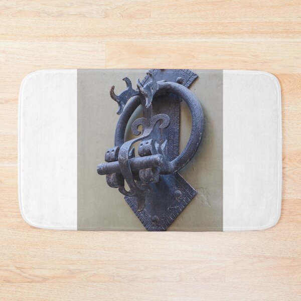 Item preview, Antique Iron Door Knocker Close-Up On Weathered Wooden Door With Decorative Hardware designed and sold by Nmallia.
