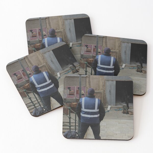 Item preview, Worker in Reflective Vest Standing on Stone Steps Outside Old Urban Building Under Renovation designed and sold by Nmallia.