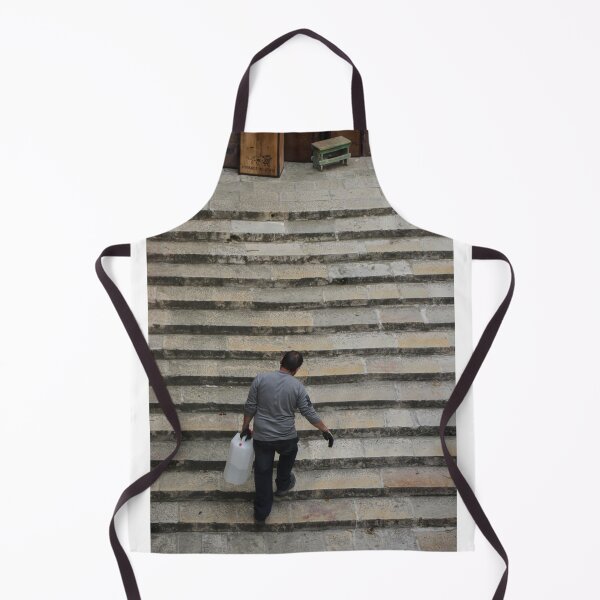 Item preview, Worker Man Carrying Plastic Jug Up Old Stone Steps Back View designed and sold by Nmallia.