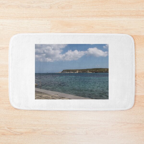 Item preview, Turquoise Sea and Sandy Beach With Cloudy Sky Over a Quiet Coastal Promenade designed and sold by Nmallia.
